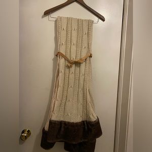 Cream colored cable knit throw